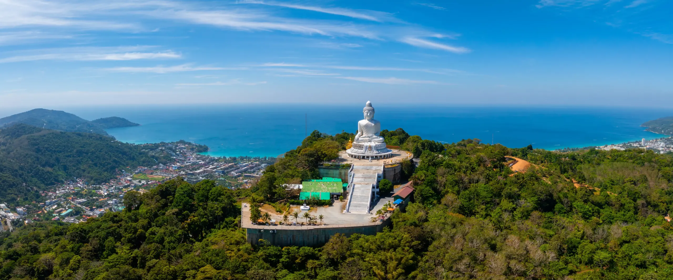 The 45-meter white marble Big Buddha on Nakkerd Hill above Chalong Bay, Phuket, at golden hour