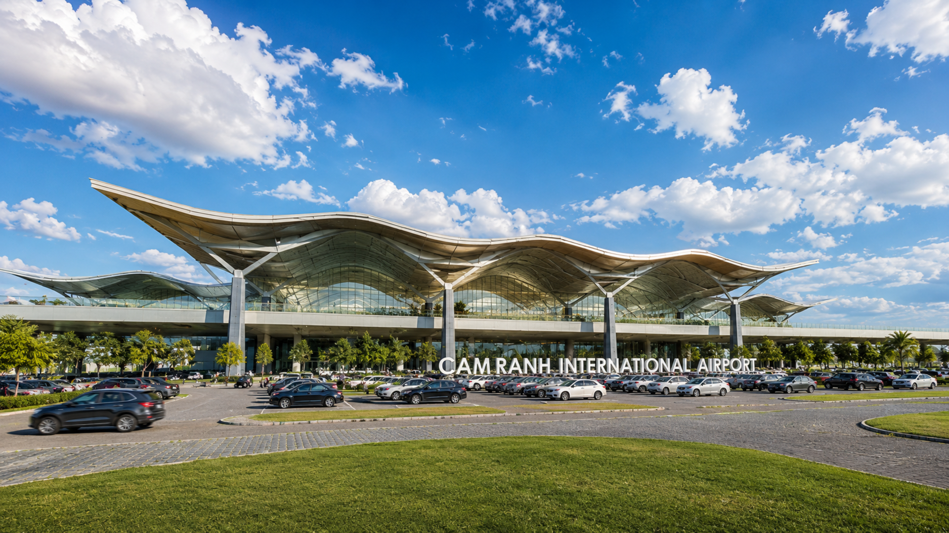Cam Ranh International Airport (CXR), Vietnam — terminal facade with parking lot and wave-shaped roof